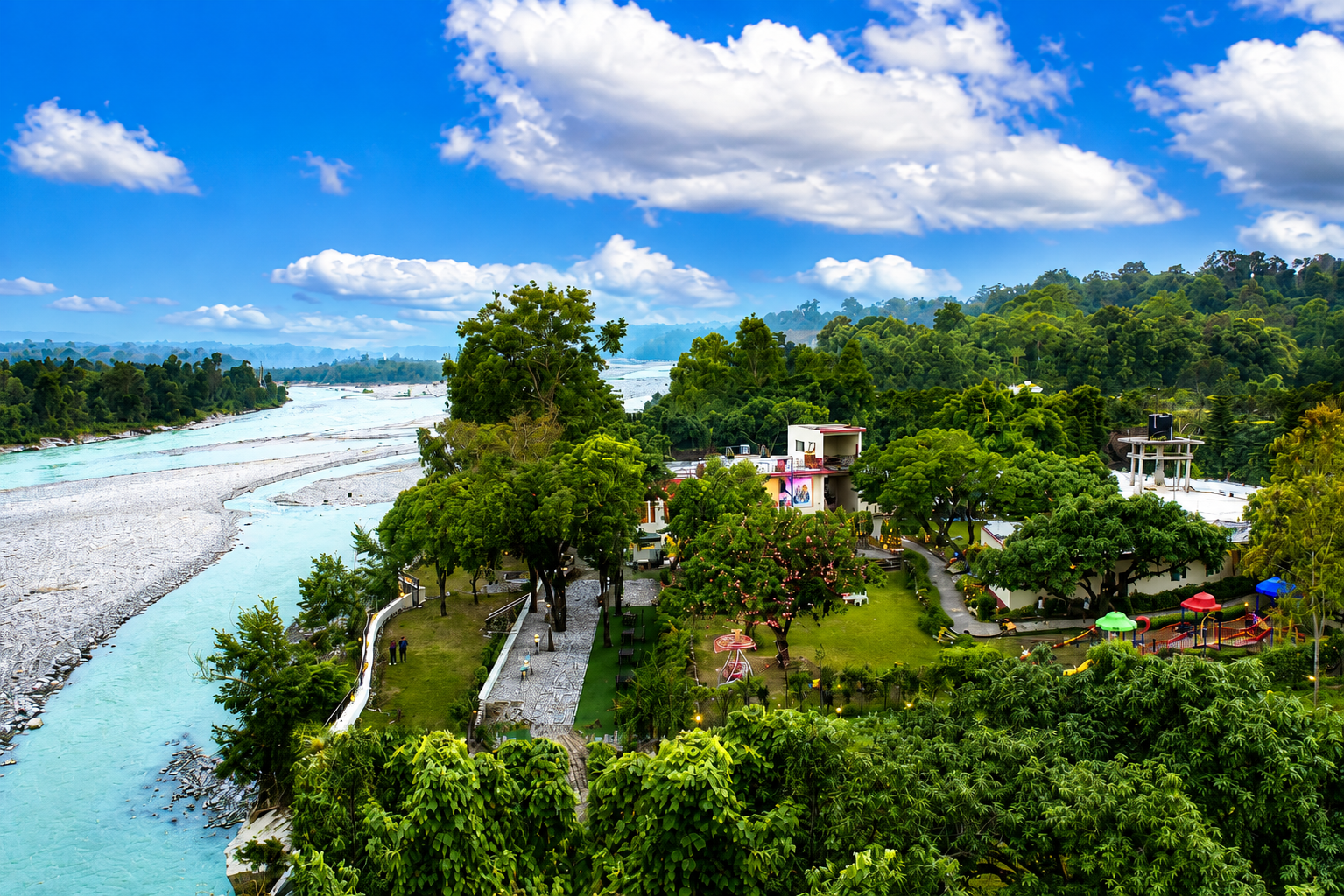 Riverside terrace at an Excel resort in the Himalayan foothills