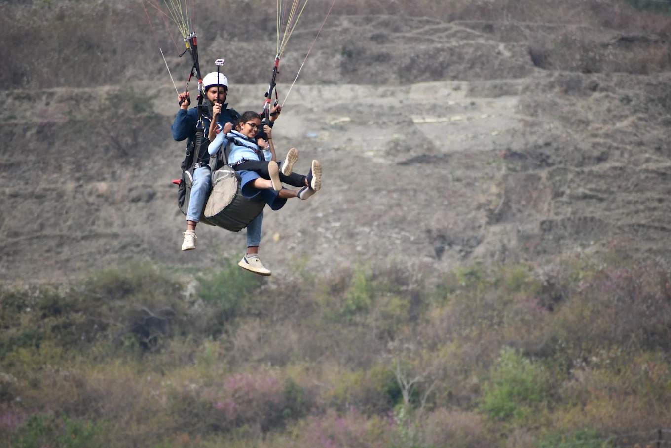 Tandem paragliding adventure above the hills near Bhimtal