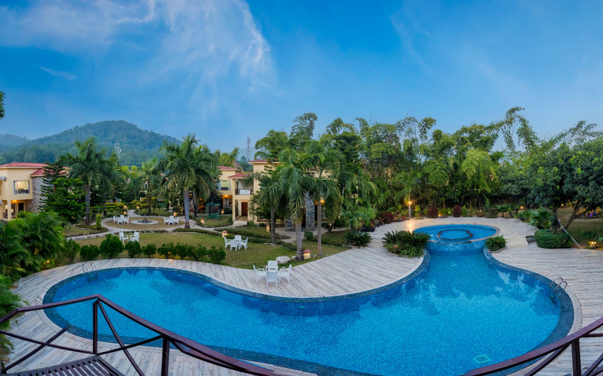 Swimming pool at dusk at Mango Bloom River Resort, Jim Corbett