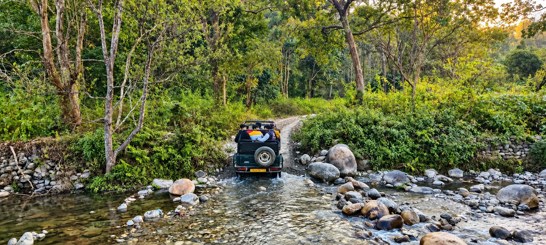 Safari jeep crossing a forest stream in the Jim Corbett region